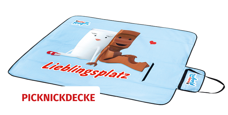 Picknick Decke mit einem Motiv von Milky und Schoki der Marke kinder Riegel und als Schriftzug 'Lieblingsplatz'